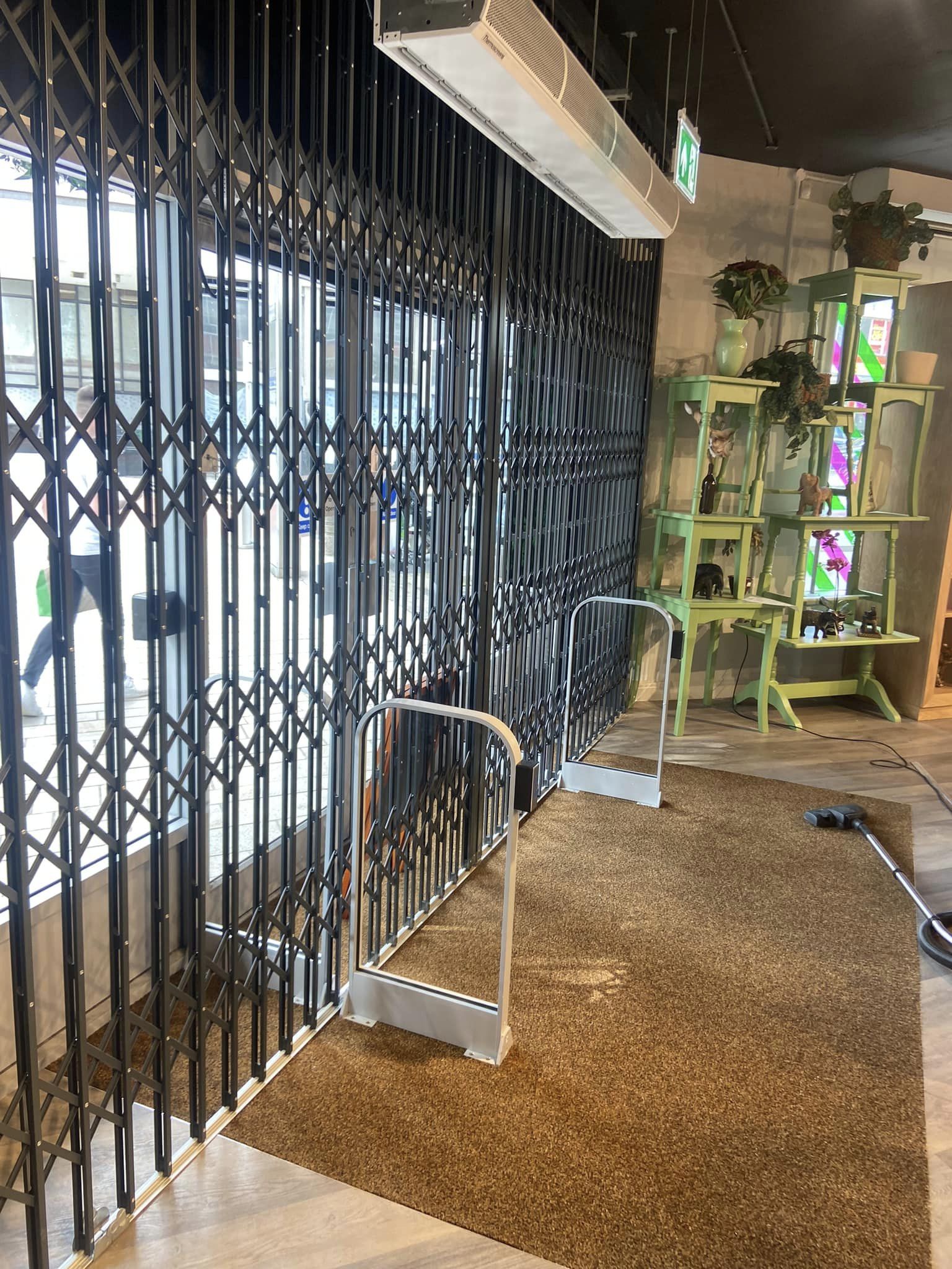 Shop entryway with a security grille