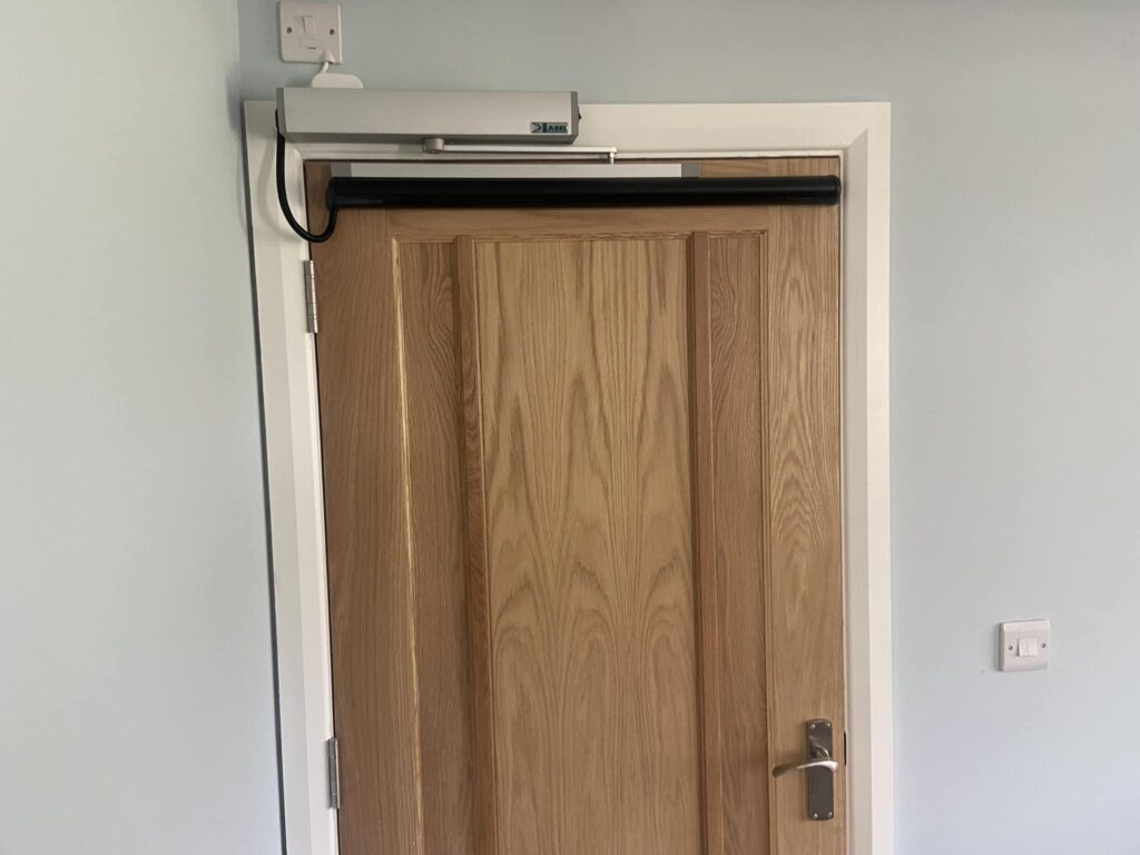 Powered indoor door for disability assistance